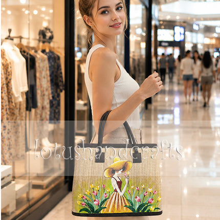 Handwoven seagrass tote bag featuring a charming hand-painted girl in a tulip garden.