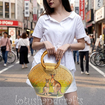 Handmade half moon seagrass straw handbag with hand painted two kangaroos and rattan handle.