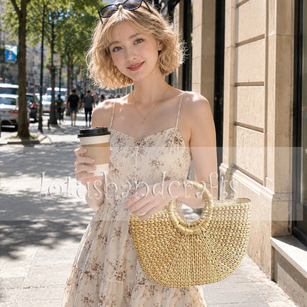 Handwoven half moon seagrass beach tote with timeless style.