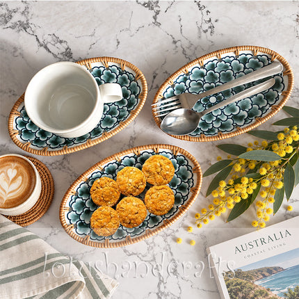 The warm rattan border frames the floral artwork beautifully while adding natural texture and an artisanal touch.