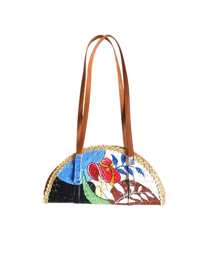 This cute woven grass half moon bag features a beautifully painted lady on the front.