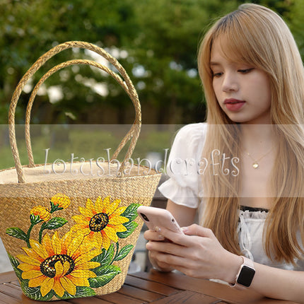 Cute handmade seagrass tote bag with sunflower artwork.