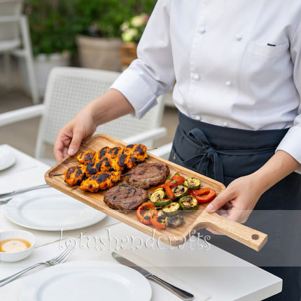 Long ash wood serving board with handle offers convenient and stylish use for everyday serving.