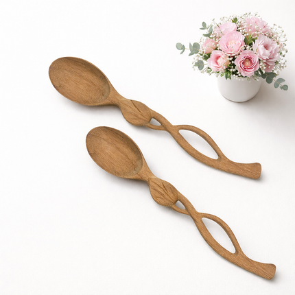 Handcrafted leaf handle wooden spoon made from ashwood offering elegance durability and natural beauty.