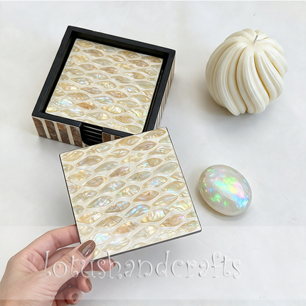 An elegant shell mosaic coaster set that combines practical drink protection with timeless botanical patterns, ideal for everyday use or thoughtful gifting.
