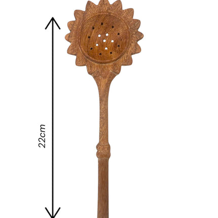 Handcrafted sunflower slotted spoon made from durable wood in a practical size for everyday cooking.