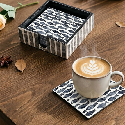 Square coasters featuring repeating school-of-fish design, smooth finish, perfect for everyday elegance.