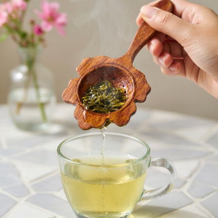 Handcrafted wooden flower slotted spoon offers versatile uses for everyday cooking and serving.