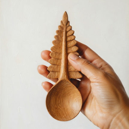 A handcrafted fern leaf wooden spoon features a beautiful design that brings natural elegance and charm to your everyday use.