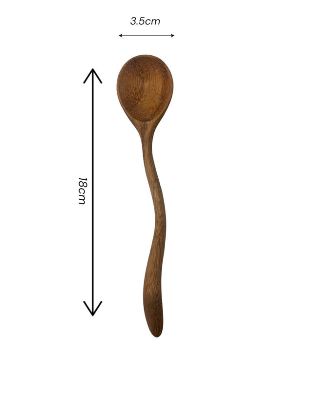 Handmade wooden spoon crafted with wavy design offers natural beauty durability and perfect size for everyday kitchen use.