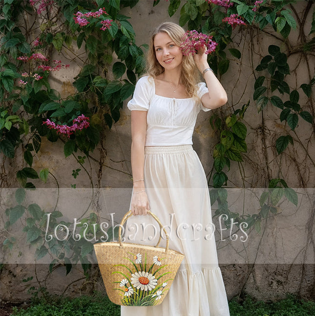 Handmade shoulder bag featuring a hand-painted daisy floral design.
