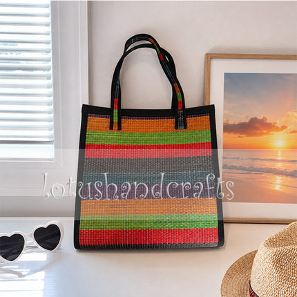 Handwoven colorful seagrass tote bag with rainbow stripes.