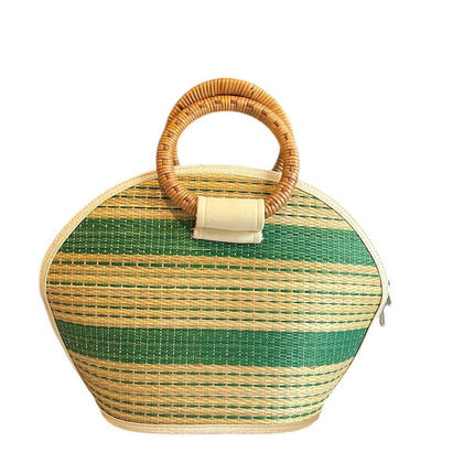 Handmade seagrass straw handbag with rattan handle in a half moon shape.