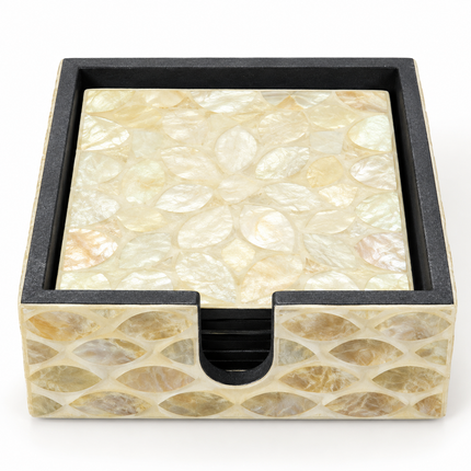 A set of six square coasters featuring a delicate abstract petal mosaic in creamy ivory, champagne gold, and pearlescent tones, complete with a matching holder.