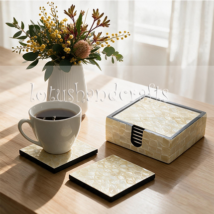 Six decorative shell coasters provide a stylish resting place for coffee mugs, teacups, and drinking glasses.