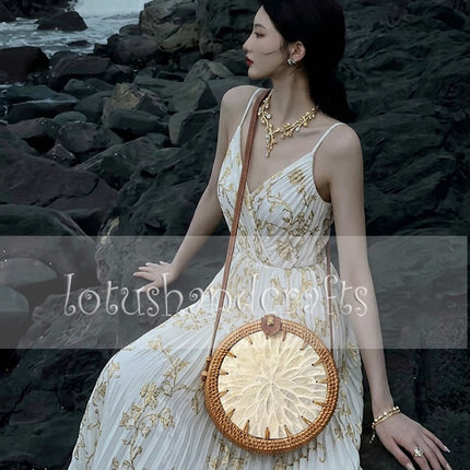 Captivating handmade round rattan crossbody bag featuring a pearl flower mother of pearl inlay.