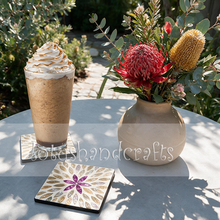 A full set of six square coasters with a matching black-trimmed holder, displayed on a wooden table.