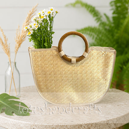 Cute handwoven straw tote bag with wooden ring handle.