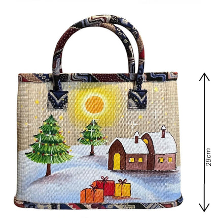Handmade woven seagrass tote bag featuring a snowy Christmas village painting.