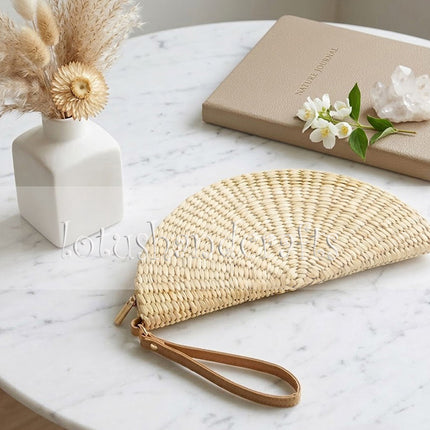 This cute and unique water hyacinth half moon clutch is perfect for your everyday style.