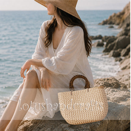 Cute handwoven water hyacinth tote bag with round rattan handles.
