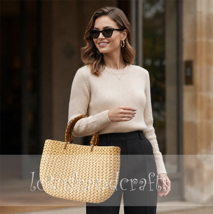Handwoven water hyacinth tote bag with round rattan handles.