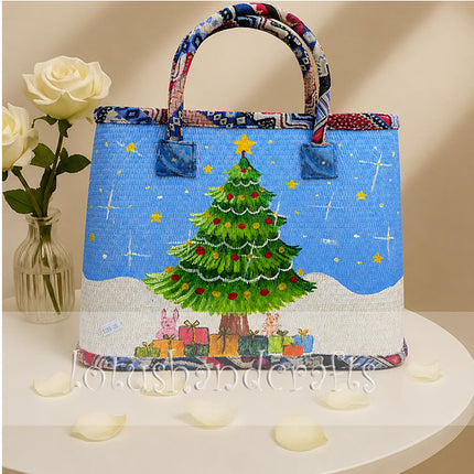 Handmade woven seagrass tote bag with painted Christmas tree design for a youthful look.