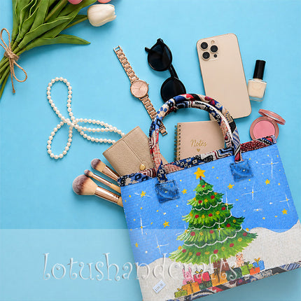 Handmade woven seagrass tote bag with painted Christmas tree design.