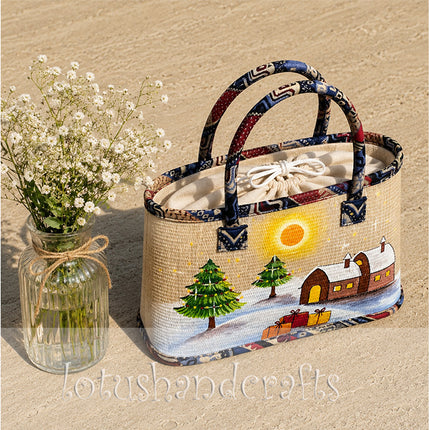 Handmade woven seagrass tote bag featuring a snowy Christmas village painting.