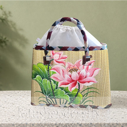 Handmade woven seagrass tote bag featuring a unique and elegant hand-painted lotus design.