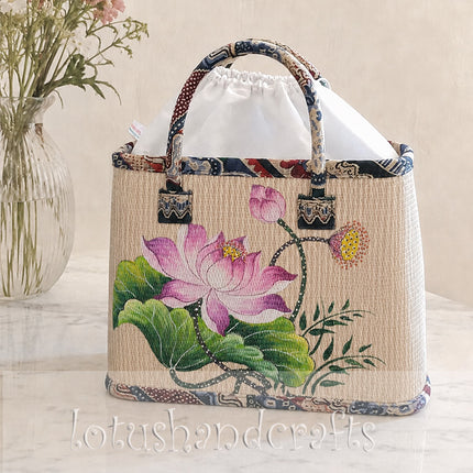 Handmade woven seagrass tote bag with a beautifully hand-painted lotus blossom.