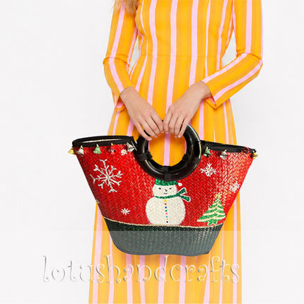 Christmas hand-painted woven seagrass tote bag with round black handle.