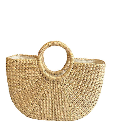 Handwoven half moon seagrass beach tote bag.