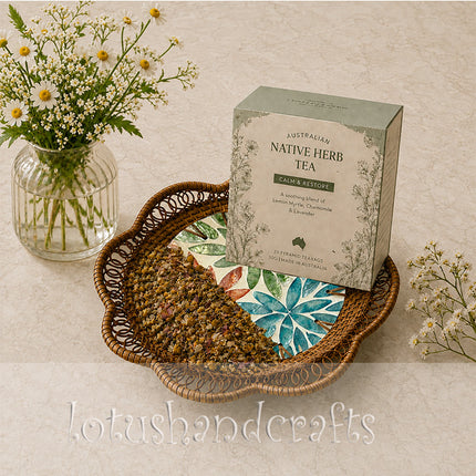 Handwoven rattan tray with a youthful twelve petal botanical rosette inlay.