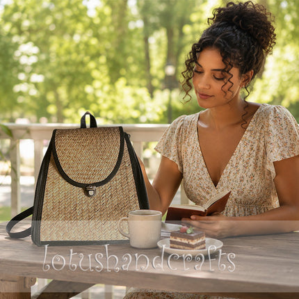 Handwoven seagrass backpack with side zipper pockets.