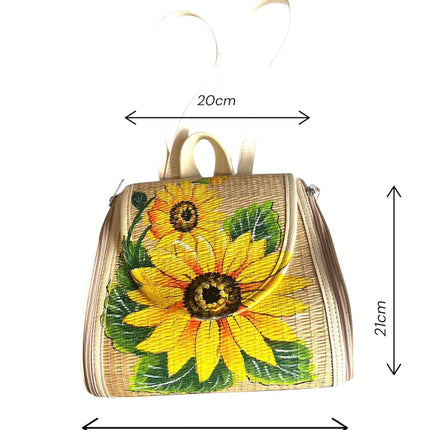 Handwoven seagrass backpack with a hand-painted sunflower.