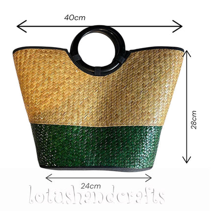 Handwoven seagrass tote bag with round black handle in natural and forest green.