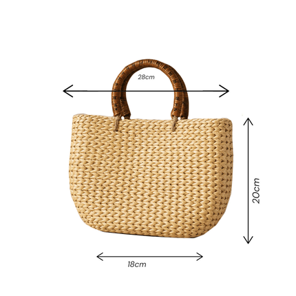 Handwoven water hyacinth tote bag with round rattan handles.