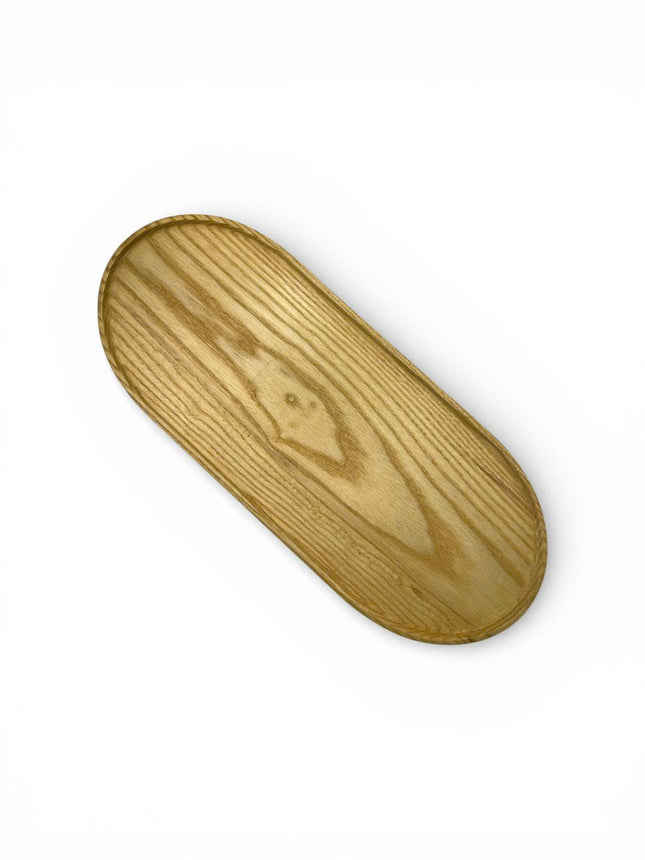 Handcarved haven oval ashwood serving tray with a cute minimalist design for cozy modern living.