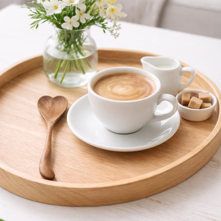 Heart shaped wooden spoon made from redwood with a smooth and natural finish.