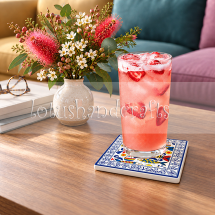 Decorative square ceramic coaster for coffee cups, tea mugs, and drinking glasses, featuring colourful sardines and intricate blue-and-white floral patterns.