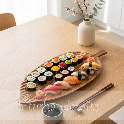 The redwood leaf serving tray with a handle is perfect for elegant food plating.