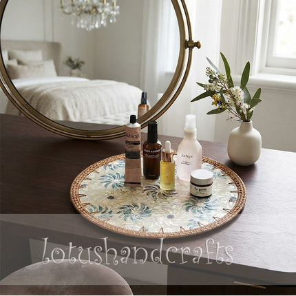 Lotushandcrafts handcrafted floral charger plate combining artisan rattan weaving with a distinctive blue-green botanical design.