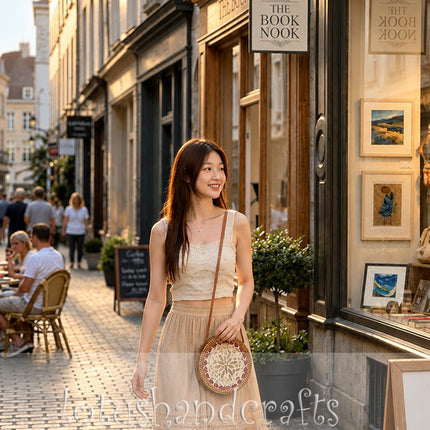 Lovely round rattan crossbody bag with unique inlaid mother of pearl.