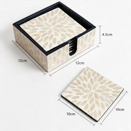 Hand-inlaid floral design on a square white shell drink coaster.