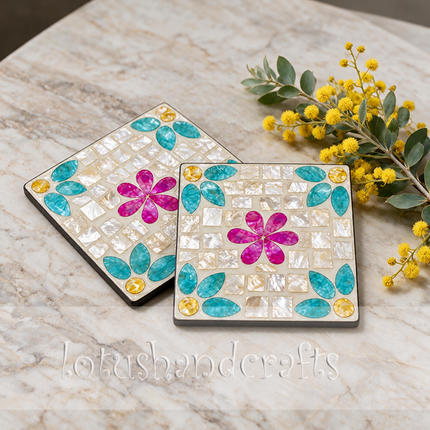 vivid pink mosaic flower center surrounded by turquoise shell petals and mother-of-pearl.