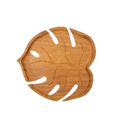 Cute redwood Monstera shaped serving tray for serving snacks, desserts, fruit, and cozy table styling.