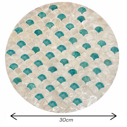 Round mother of pearl placemat with turquoise fish scale mosaic, 30 cm diameter.