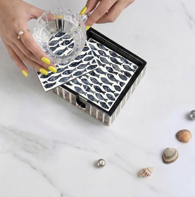 Refined mother-of-pearl coasters styled with warm latte -brings coastal charm to your table.
