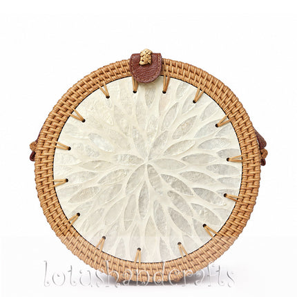Cute handmade round rattan crossbody bag featuring a pearl flower mother of pearl inlay.